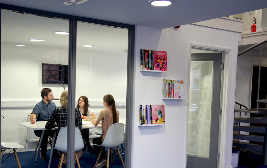 Jake, Chloe, Daisy and Eloise are having a discussion in the Social Change UK meeting room.